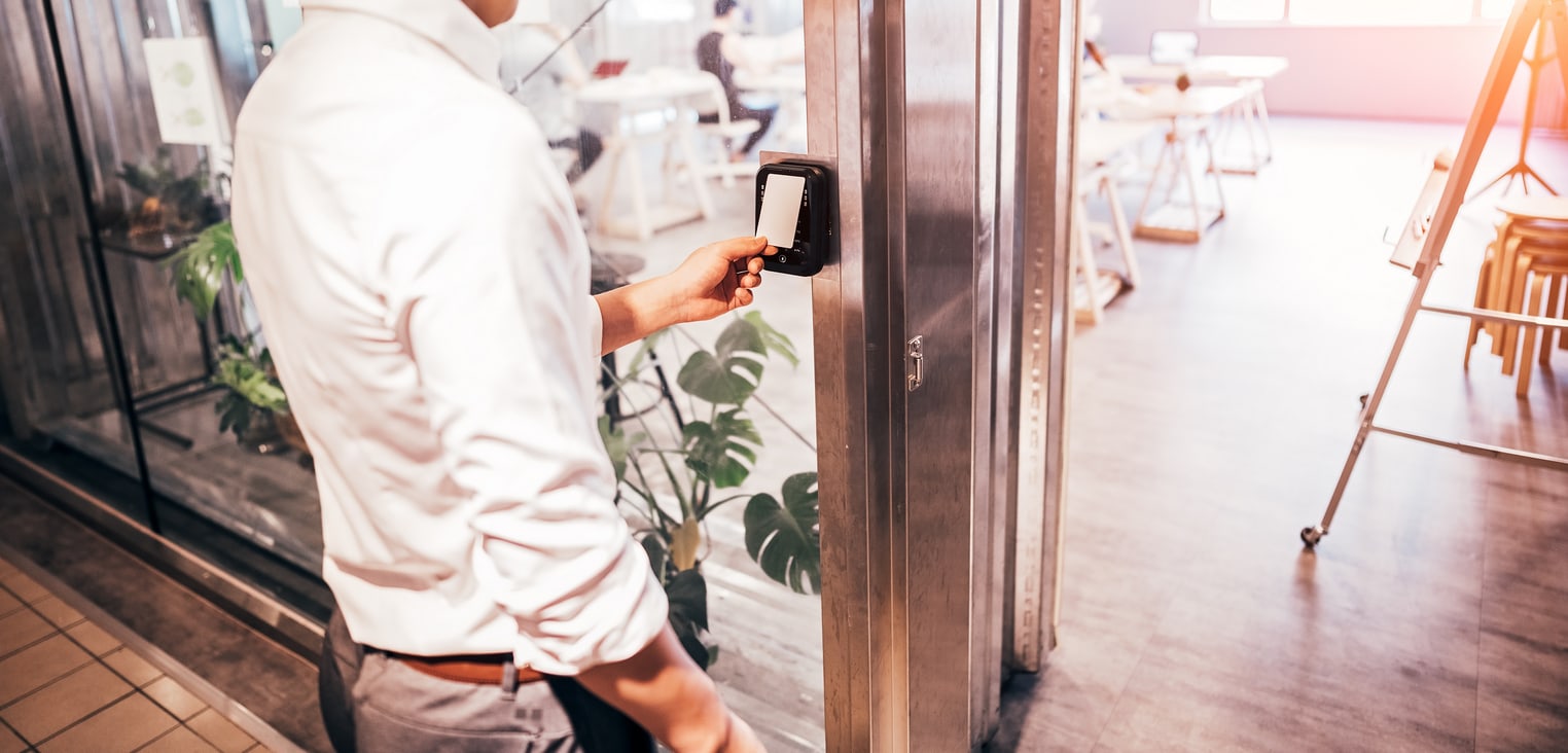 Male staff scan the Security card  to enter the operating room