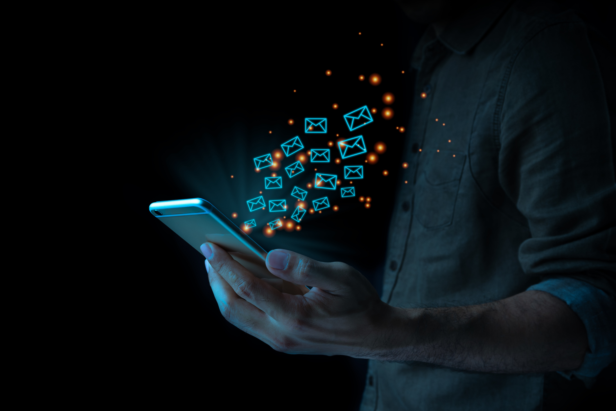 Close up of business man using mobile smart phone sending email